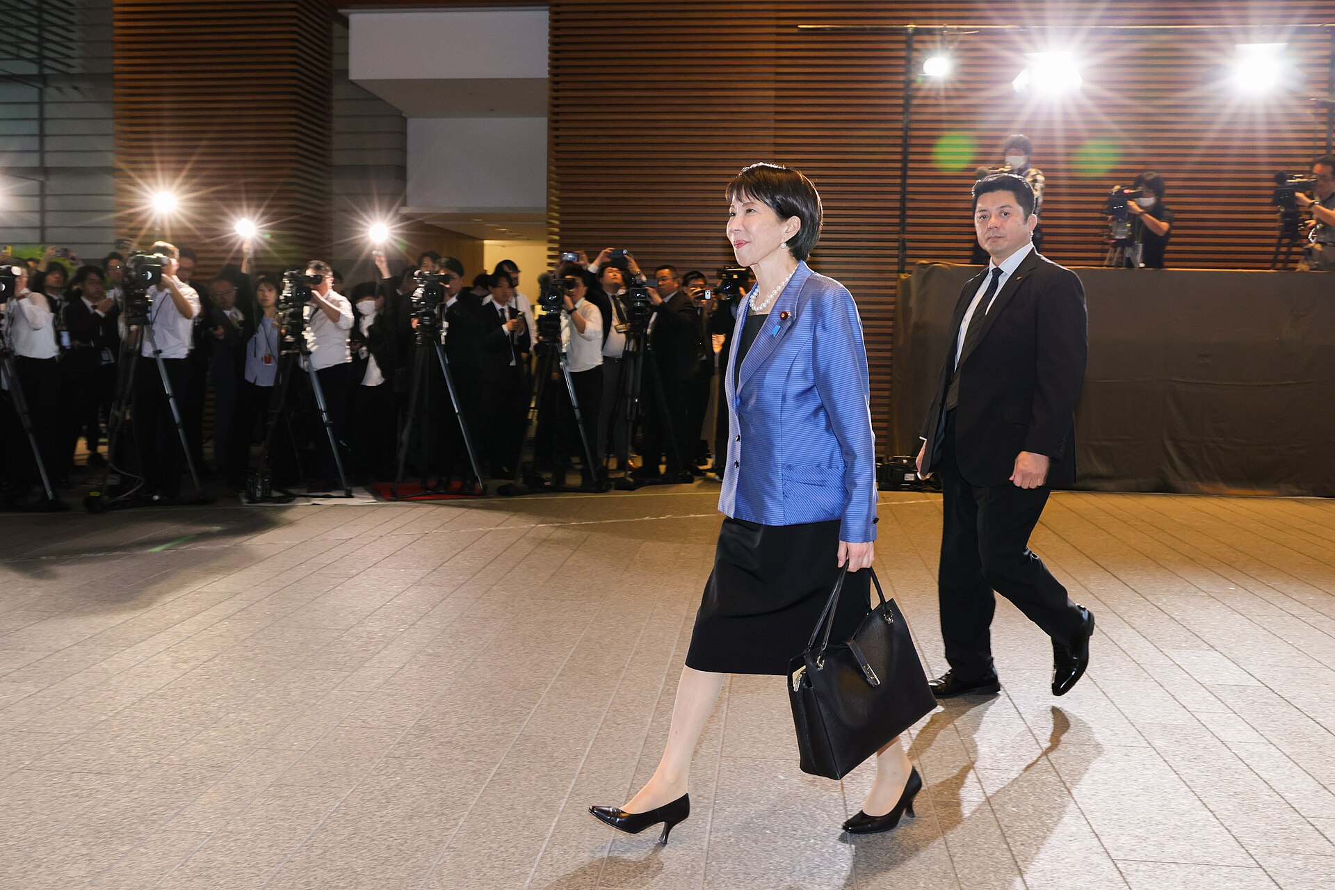 Sanae Takaichi walks into the Prime Minister's Official Residence (Kantei) on her first day as Prime Minister